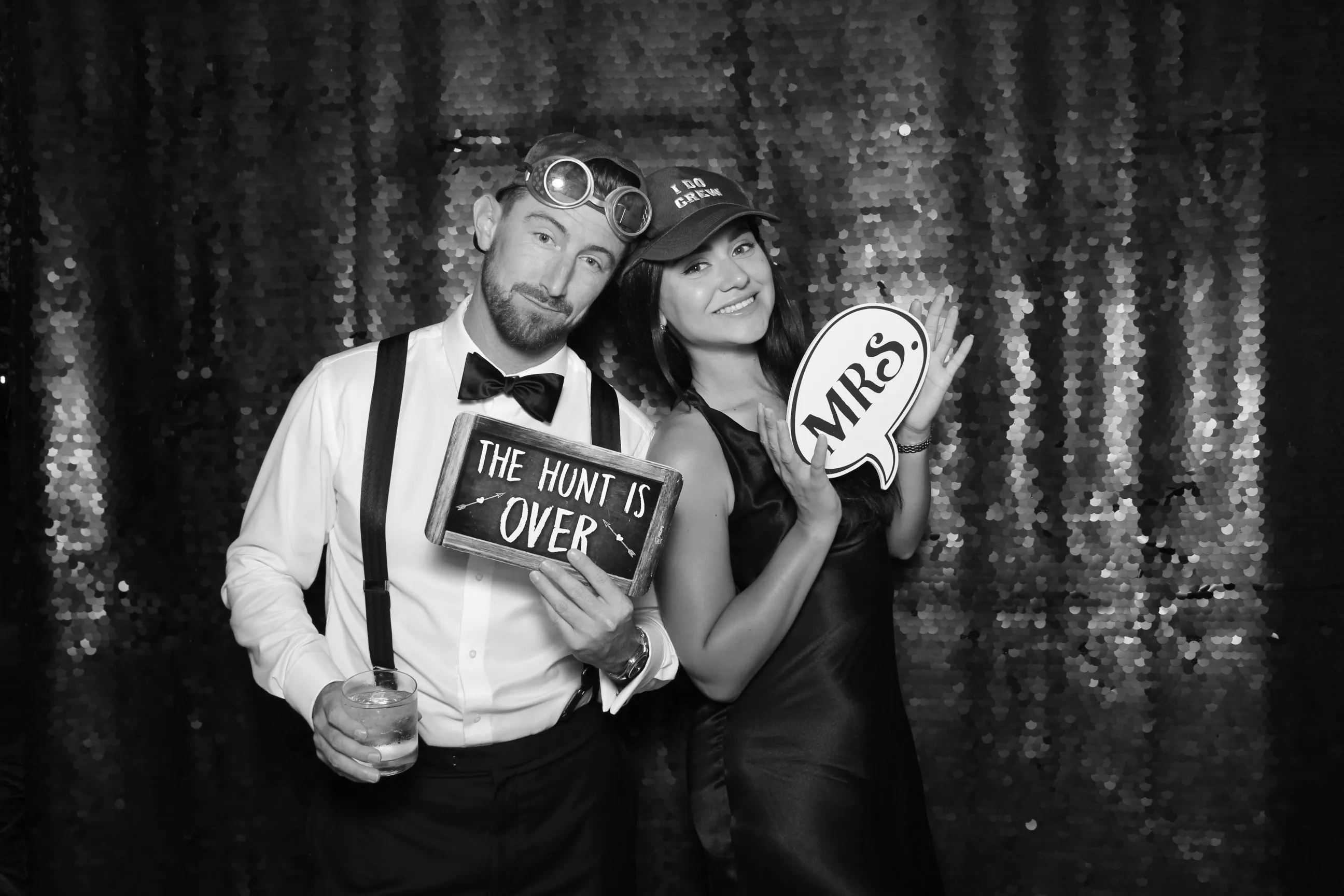 Bride and groom portrait inside a glam booth with luxury black tie styling.